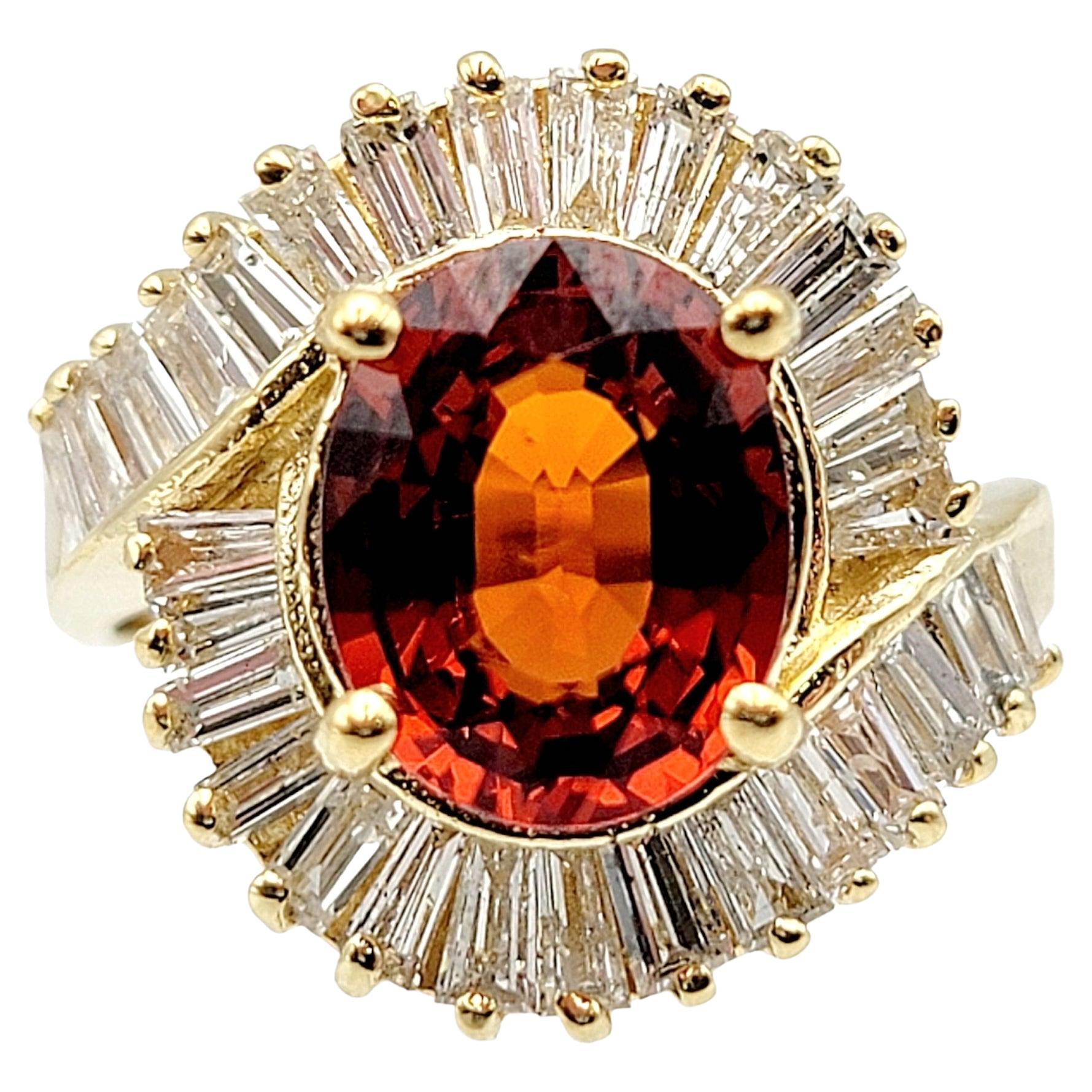 Oval Cut Garnet and Baguette Diamond Swirl Halo Cocktail Ring in 14 Karat Gold For Sale