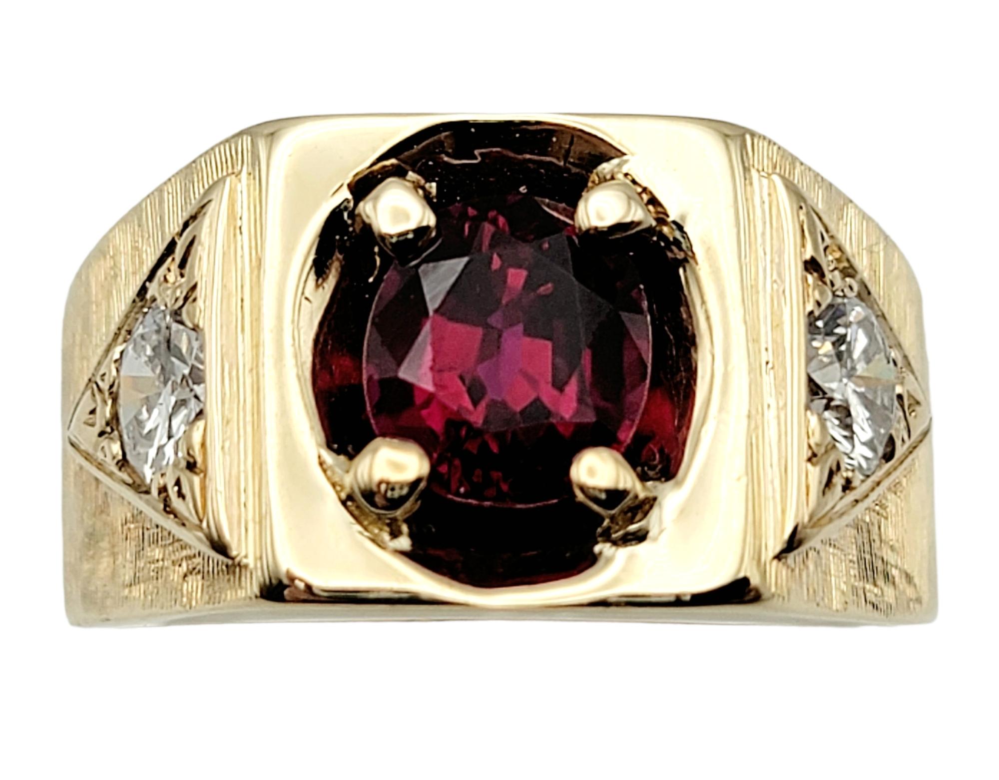 Ring size: 7.75

Bold and beautiful signet style unisex ring. The incredible red gemstone really pops, while the heavily textured brushed gold band adds to the elegant feel of the unique piece.  

This amazing ring features a single 1.60 carat oval