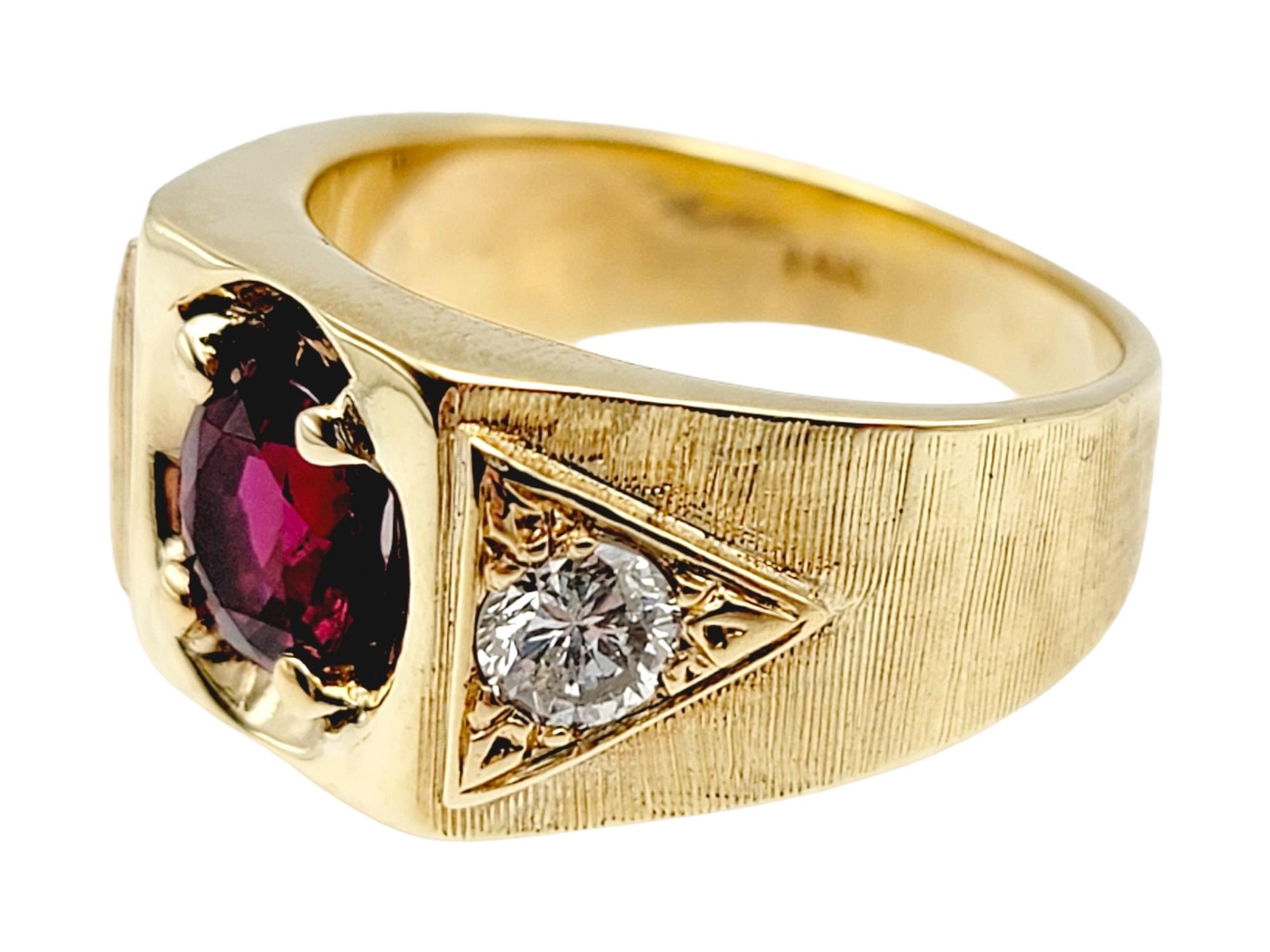 Contemporary Oval Cut Garnet and Round Diamond Unisex Signet Style Ring 14 Karat Yellow Gold For Sale