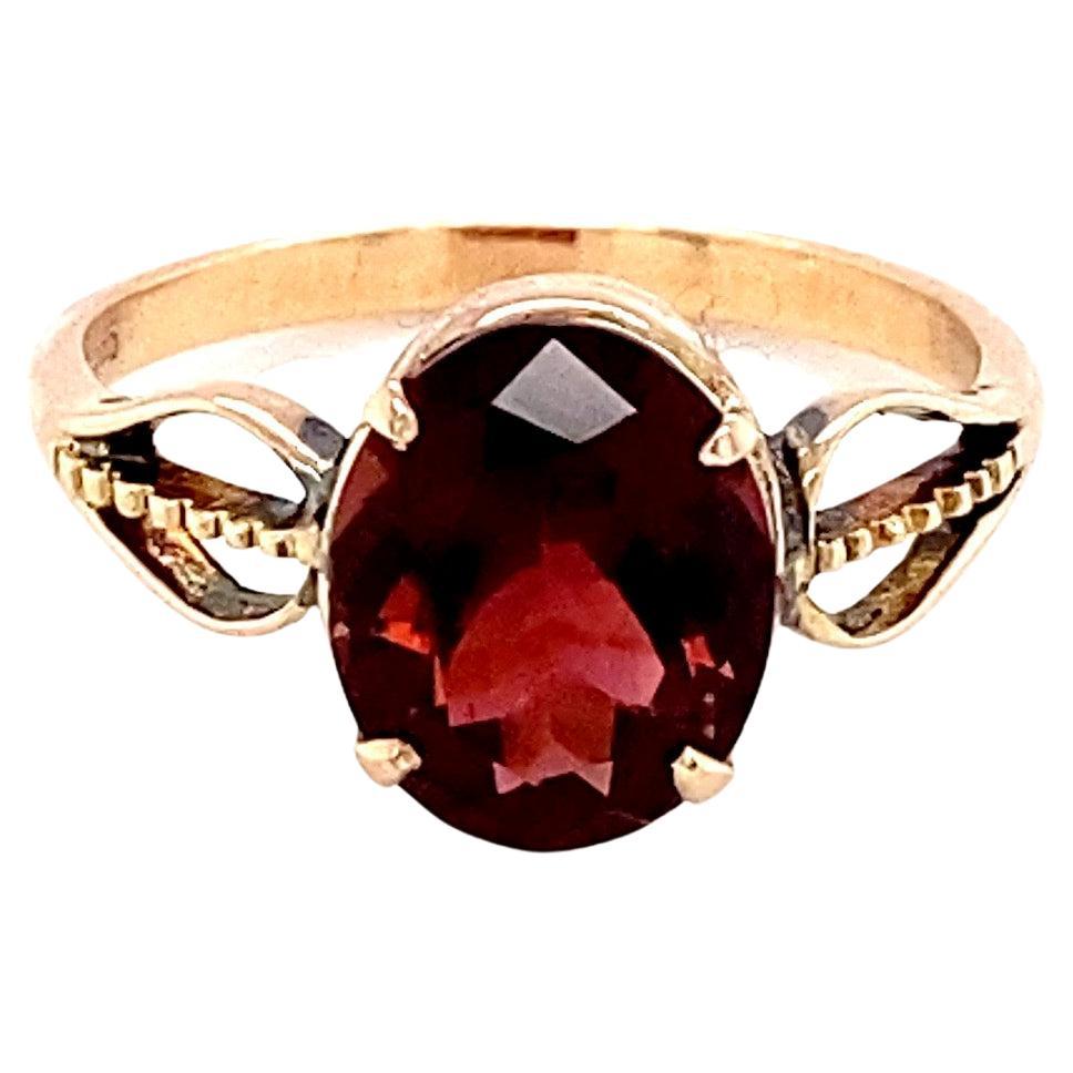 Oval Cut Garnet Yellow Gold Solitaire Ring