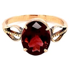Oval Cut Garnet Yellow Gold Solitaire Ring
