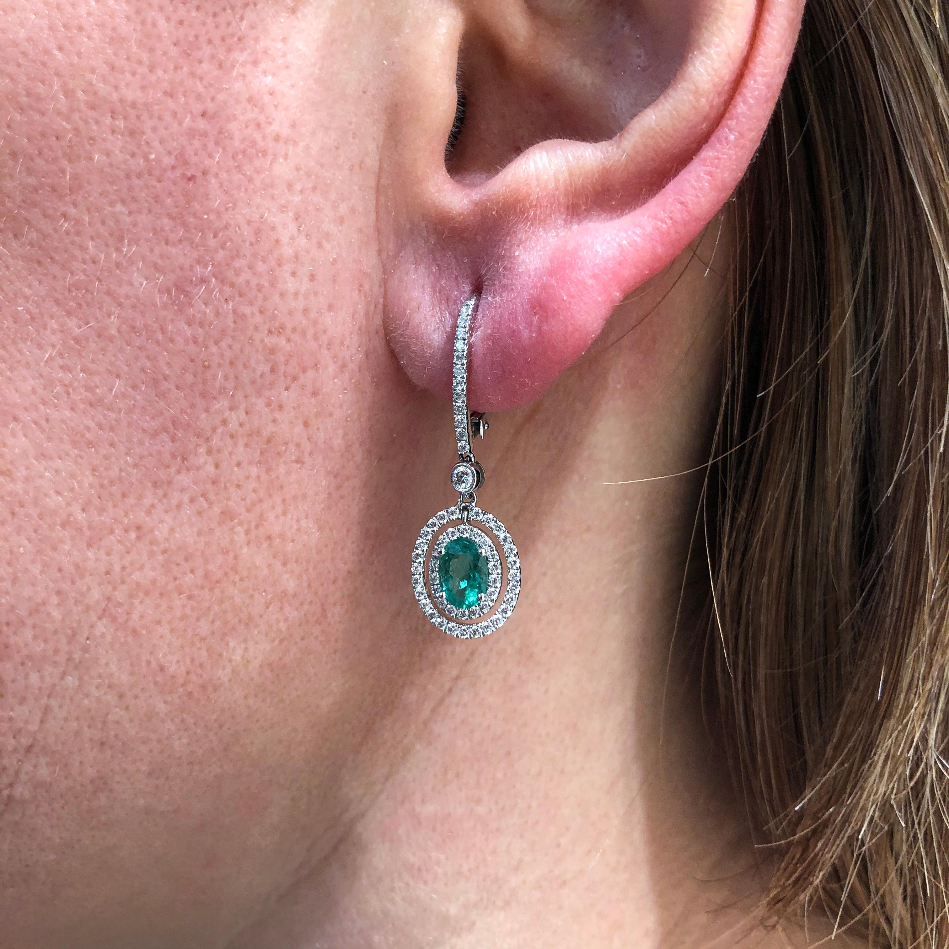 1.01 Carats Total Oval Cut Emerald and Diamond Halo Dangle Earrings For Sale 1
