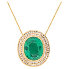 Oval cut green tourmaline and diamonds pendant on a 14k yellow gold 20 inches
