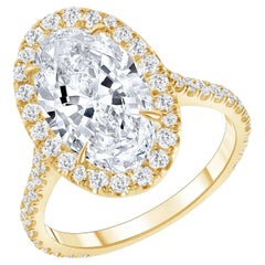 Ovaler Halo Verlobungsring aus 18 Karat Gold mit Diamanten in Pavé-Fassung