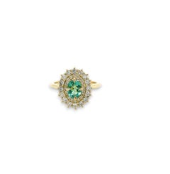 Oval Cut Halo Paraiba ring with double diamond halo in 18ct yellow gold