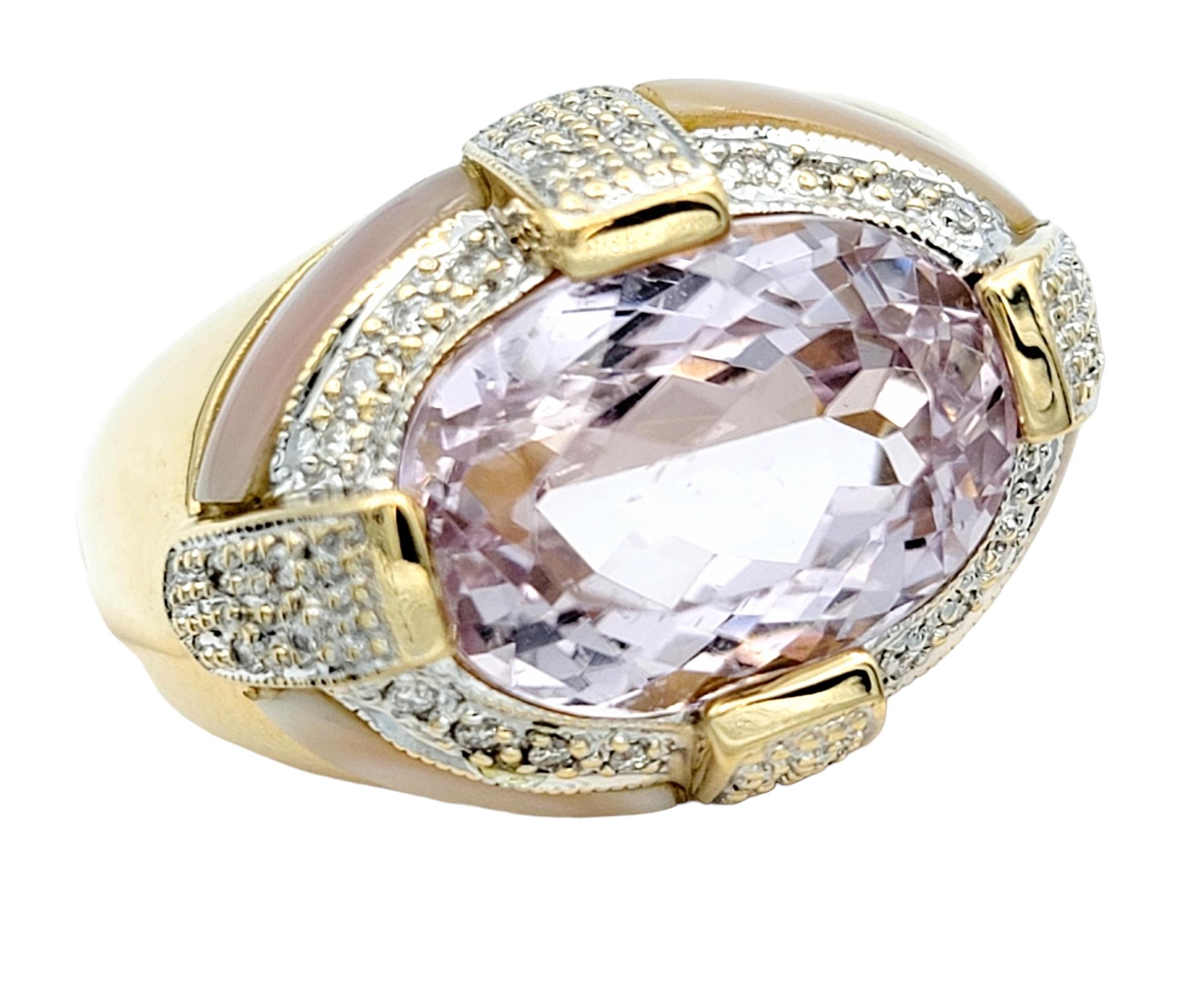 Ring size: 8

This resplendent cocktail ring exudes an aura of femininity and is a true masterpiece in design. At its core lies a magnificent 7.14 carat horizontally set oval-cut light pink kunzite, its gentle hue like a soft whisper of elegance.