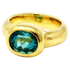 Oval-Cut Light Green Tourmaline Ring Set in 18k Yellow Gold