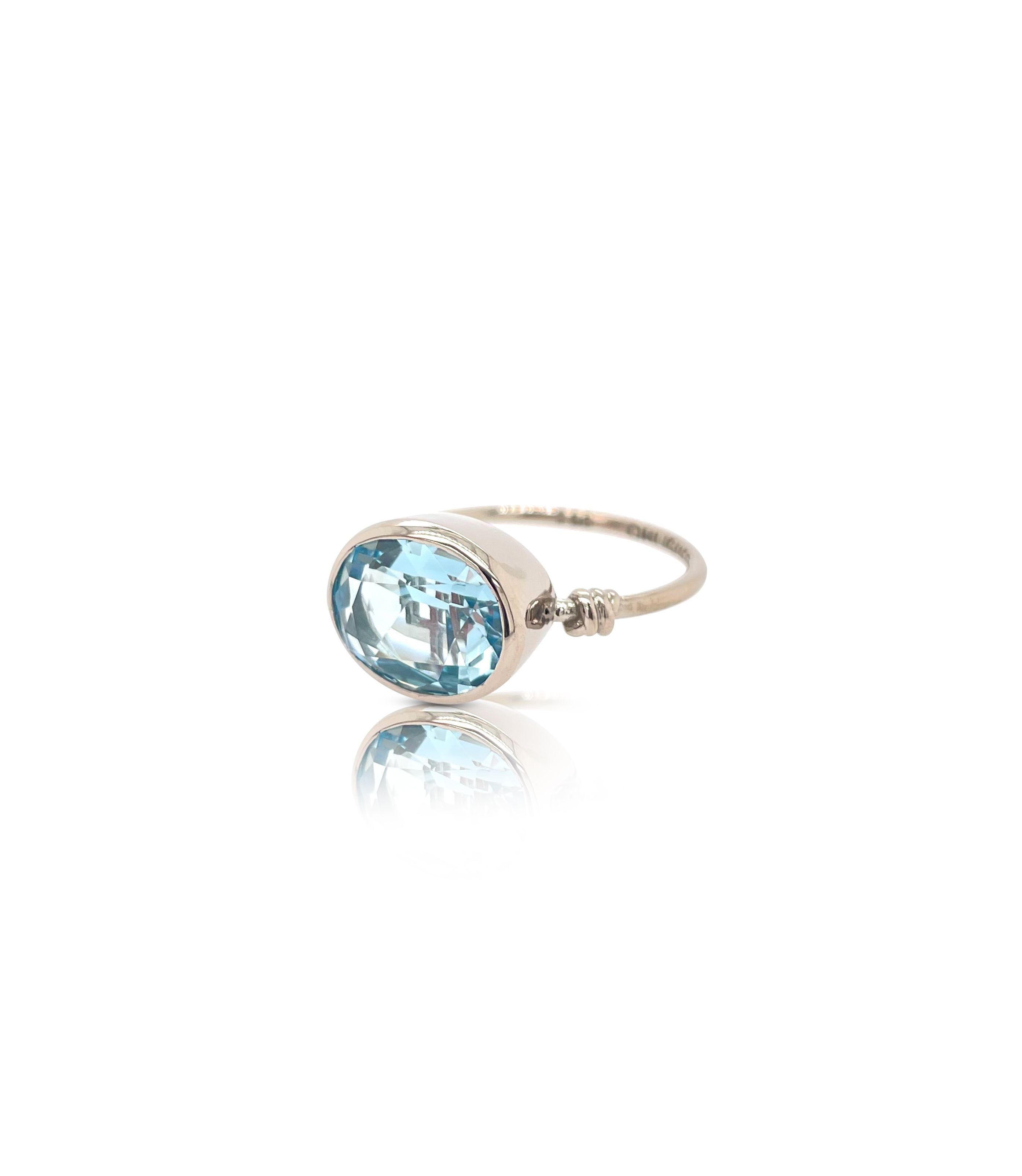 Oval Cut Oval cut London Blue Topaz in Love Knot Style Ring in 18ct White Gold For Sale