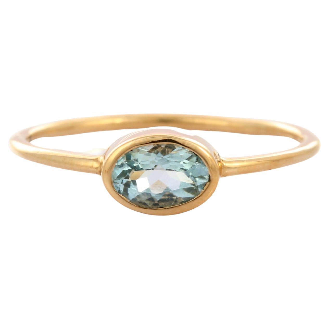 Anillo solitario de aguamarina natural talla oval en oro amarillo de 14 quilates