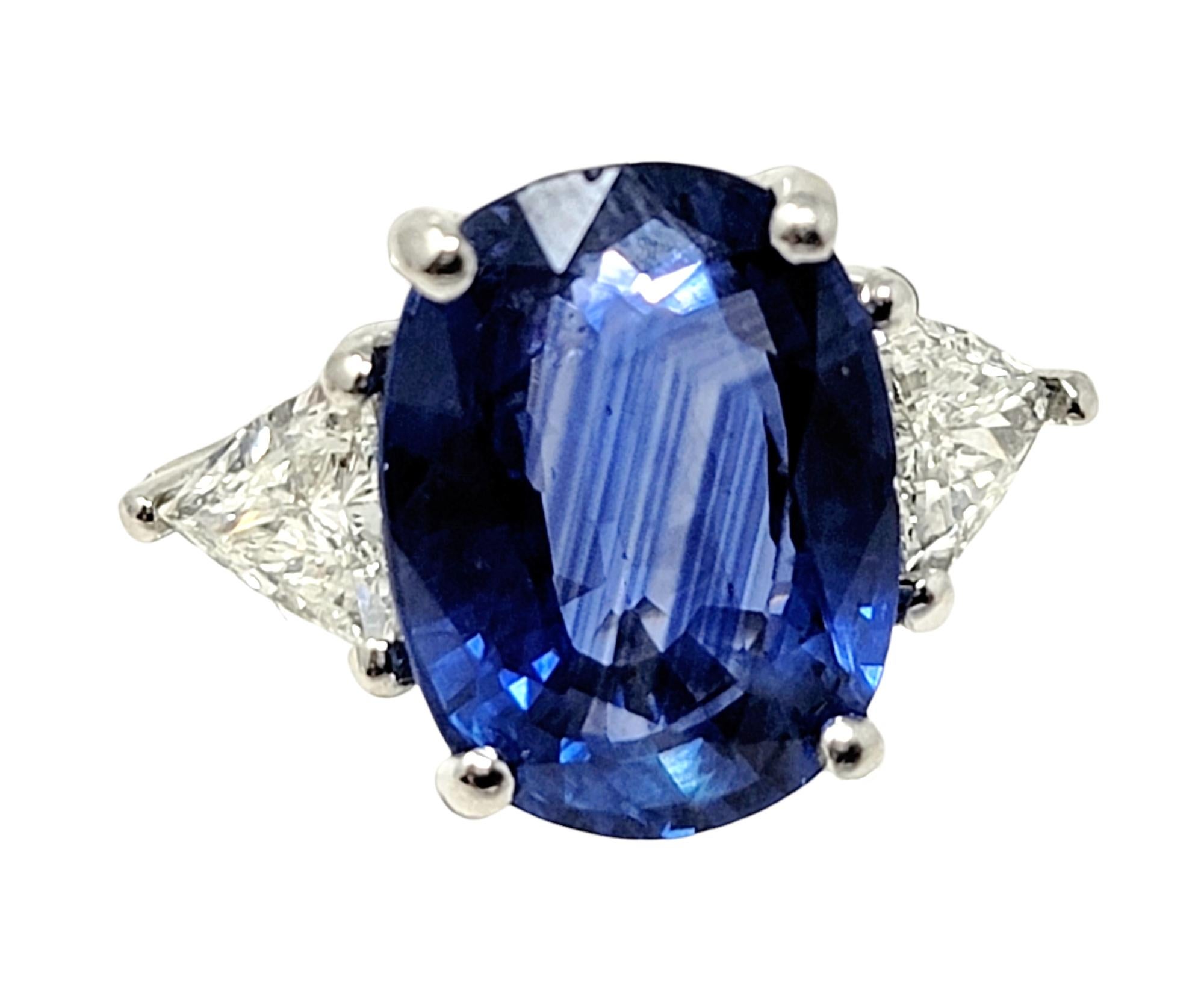 This incredible sapphire and diamond three-stone ring will absolutely take your breath away. This is a truly extraordinary piece with stunning fine details. The brilliant blue sapphire stone against the bright white natural diamonds really catches