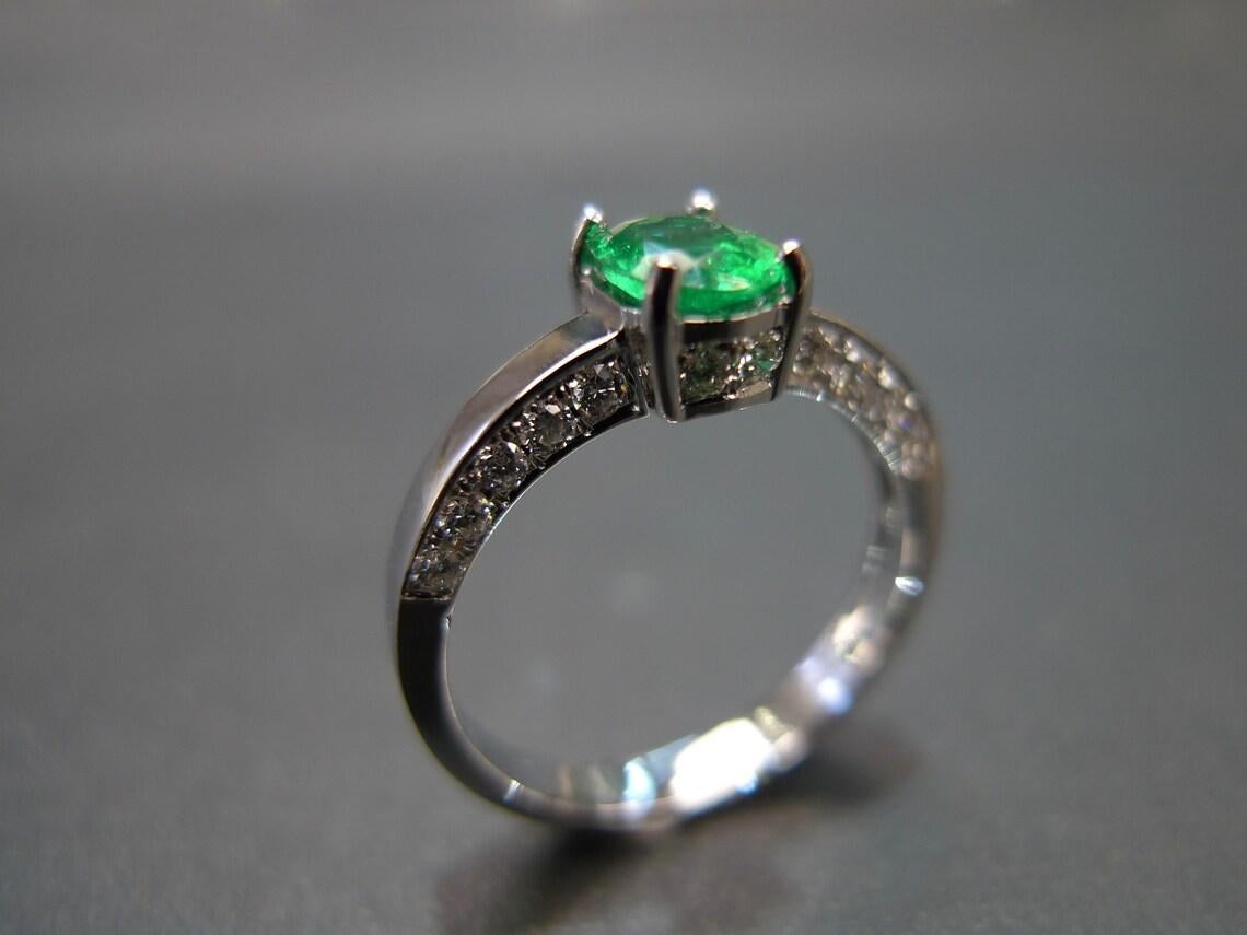 For Sale:  Oval Cut Natural Emerald and Round Brilliant Cut Diamond Engagement Ring 4