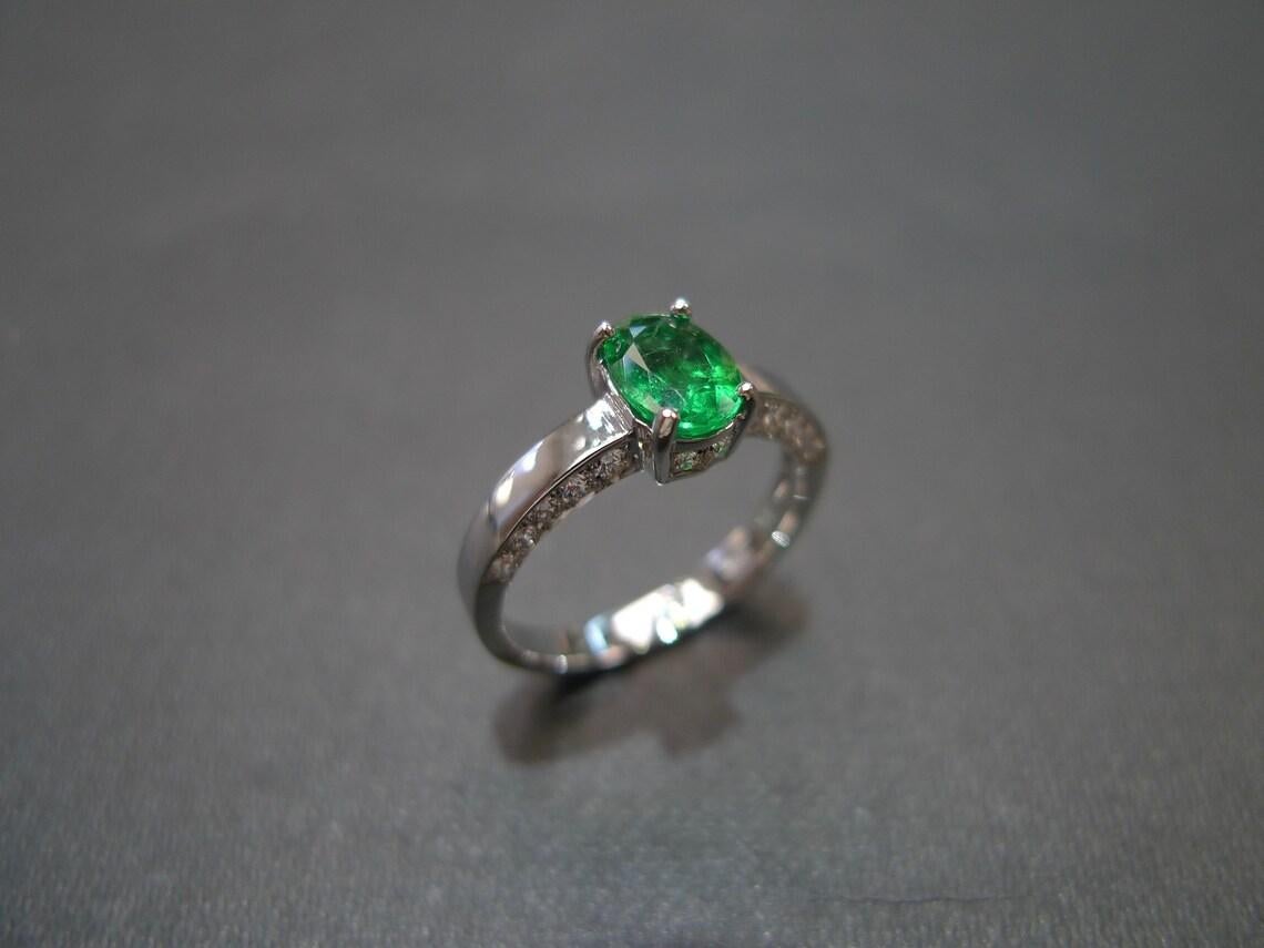 For Sale:  Oval Cut Natural Emerald and Round Brilliant Cut Diamond Engagement Ring 9