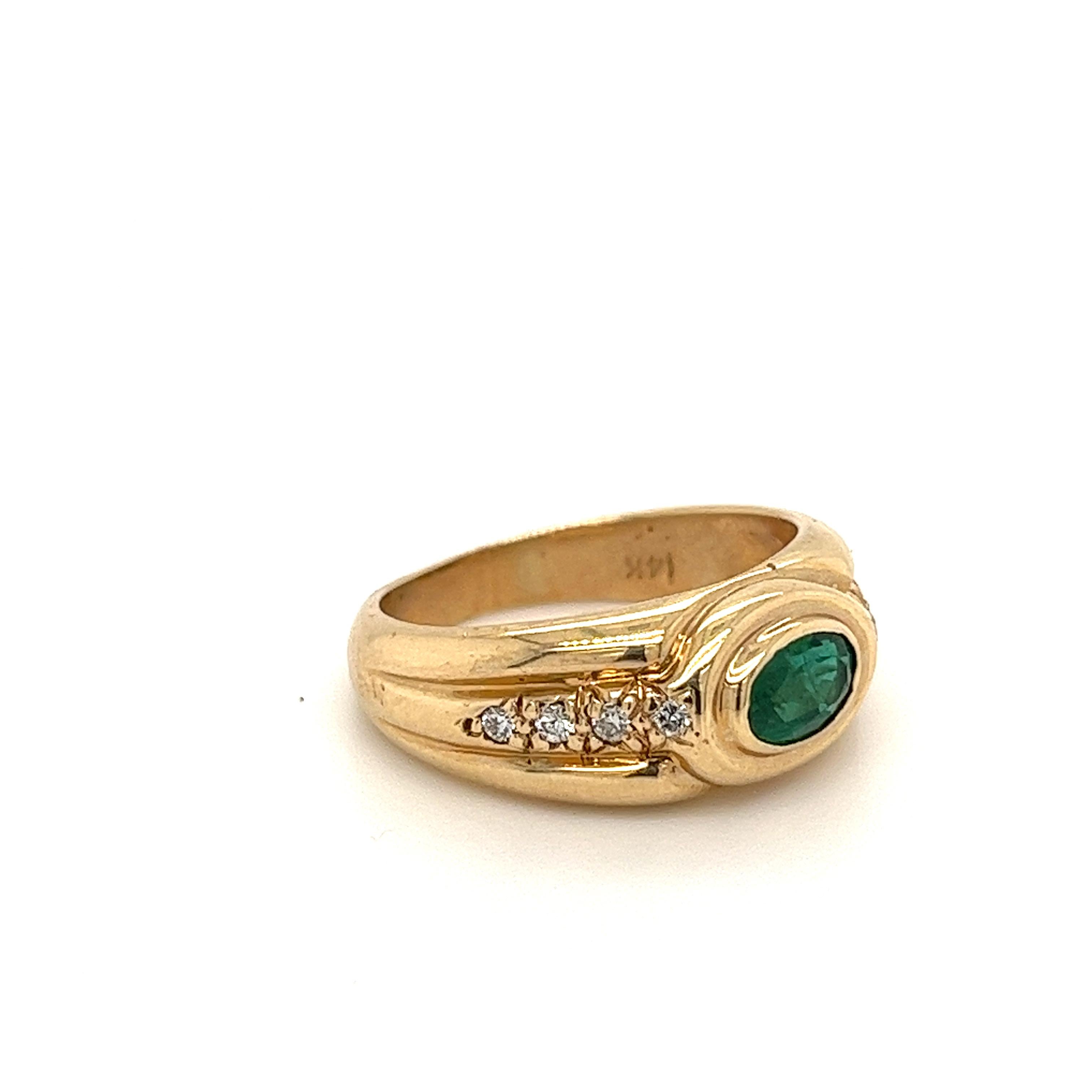 Natural emerald set with natural round cut diamond side stones in 14k yellow gold ring. Suitable as a men's pinky ring and ladies cocktail ring. 

Hypoallergenic, waterproof, and tarnish-proof. Ideal for daily wear. 

Specifics:
✔ Natural Emerald
✔