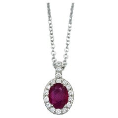 Oval Cut Natural Ruby and Diamond Halo Pendant Necklace in 18 Karat White Gold
