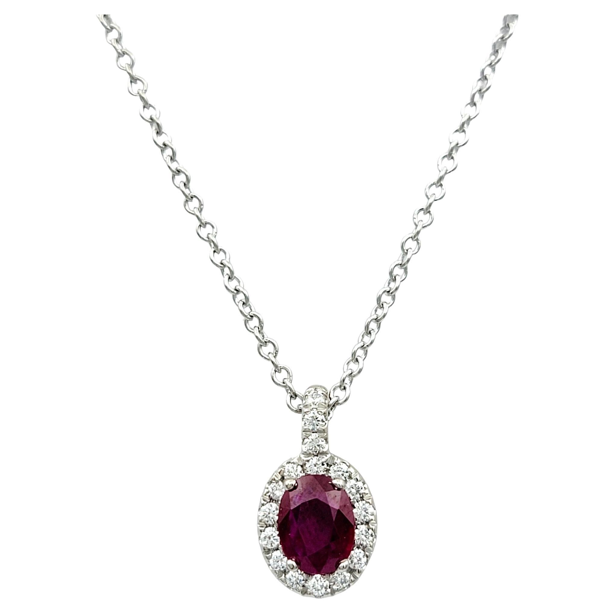 Oval Cut Natural Ruby and Diamond Halo Pendant Necklace in 18 Karat White Gold