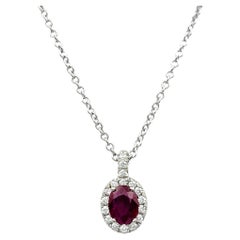 Oval Cut Natural Ruby and Diamond Halo Pendant Necklace in 18 Karat White Gold