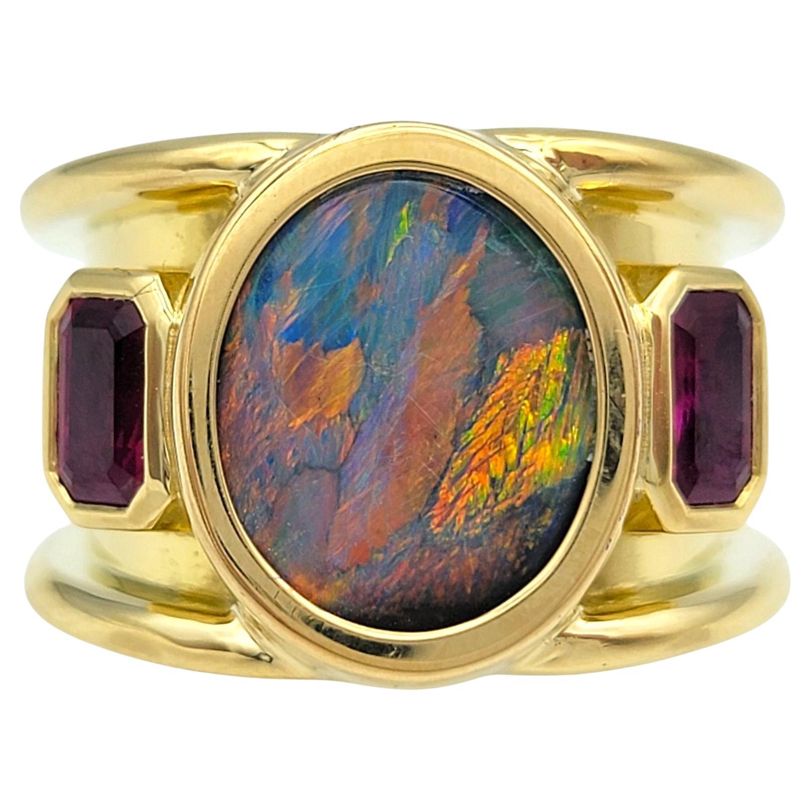 Oval Cut Opal and Radiant Cut Ruby Wide Band Ring in 18 Karat Yellow Gold For Sale