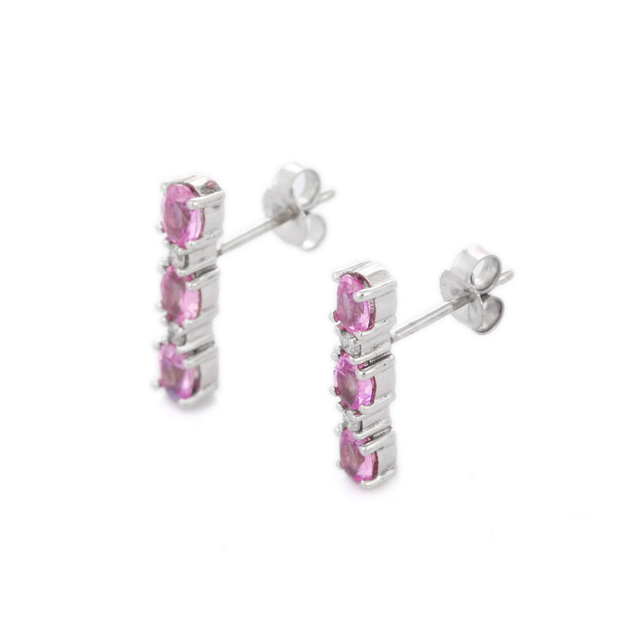 Pink Sapphire Dangle earrings to make a statement with your look. These earrings create a sparkling, luxurious look featuring oval cut gemstone.
If you love to gravitate towards unique styles, this piece of jewelry is perfect for you.

PRODUCT