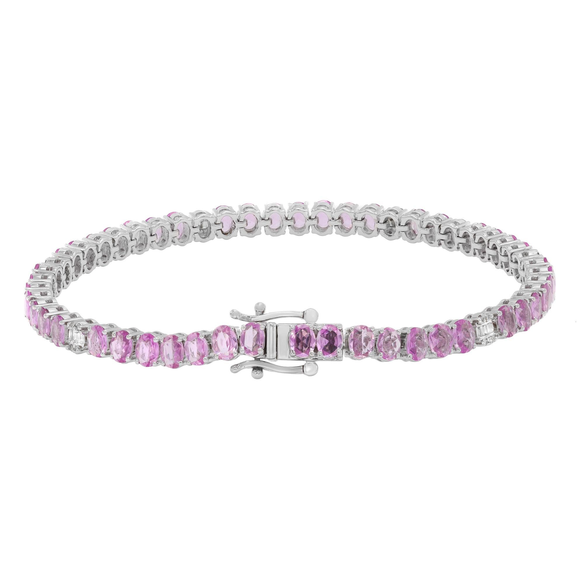This beautifully crafted tennis bracelet features oval shaped pink Sapphires with tiny baguette and round cut diamonds in prong and channel setting. Crafted in 14k white gold. Total diamond weight: 0.24 carats. Diamond Quality: G-H color and SI