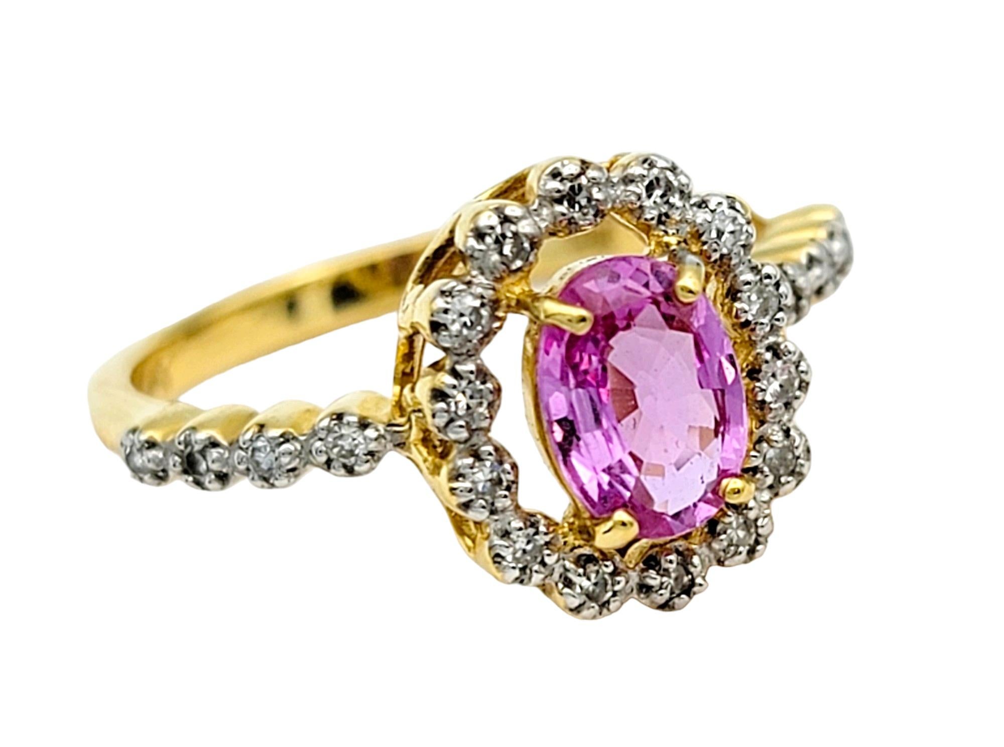 Contemporary Oval Cut Pink Sapphire Ring with Floating Diamond Halo in 18 Karat Yellow Gold  For Sale