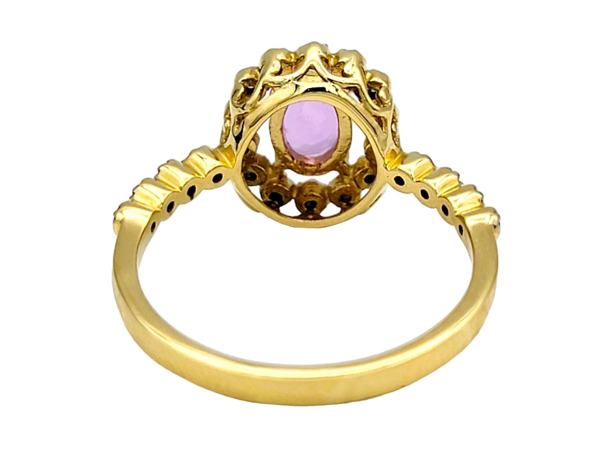 Women's Oval Cut Pink Sapphire Ring with Floating Diamond Halo in 18 Karat Yellow Gold For Sale