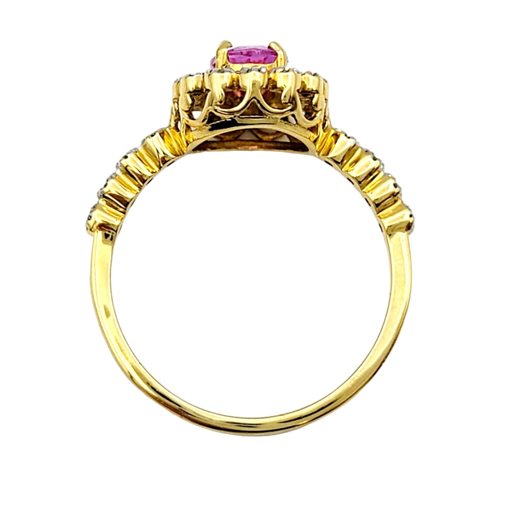 Oval Cut Pink Sapphire Ring with Floating Diamond Halo in 18 Karat Yellow Gold  For Sale 1