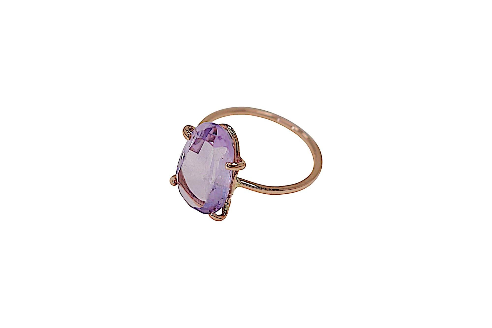 Contemporary ring handmade in 9 carat rose gold with oval cut amethyst, 0.55x0.35 inches. Finger size: US size 5 1/2, Italian size 11, UK size L 1/2, French size 51. The ring can be re-sized to the customer's size before shipping. Marked with 9