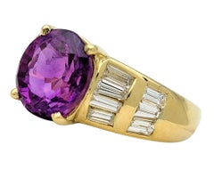 Oval Cut Purple Sapphire and Baguette Diamond Ring in 18 Karat Yellow Gold