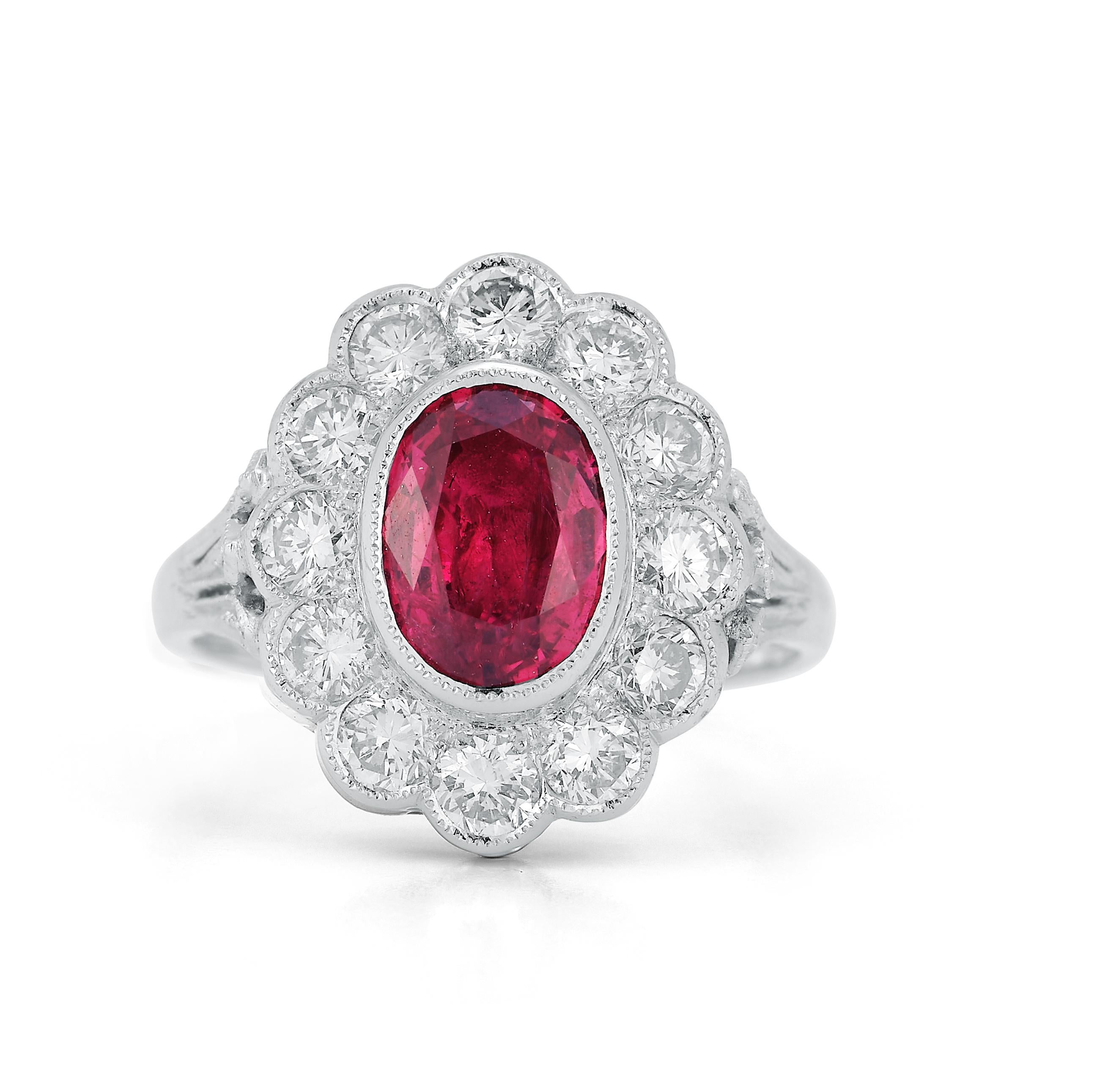 Oval Cut Rubellite & Diamond Flower Ring

 18K white gold ring with center oval rubellite approximately 1.04 ct surrounded by 12 brilliant diamonds approximately 1.20 ct

Ring Size: 5.75