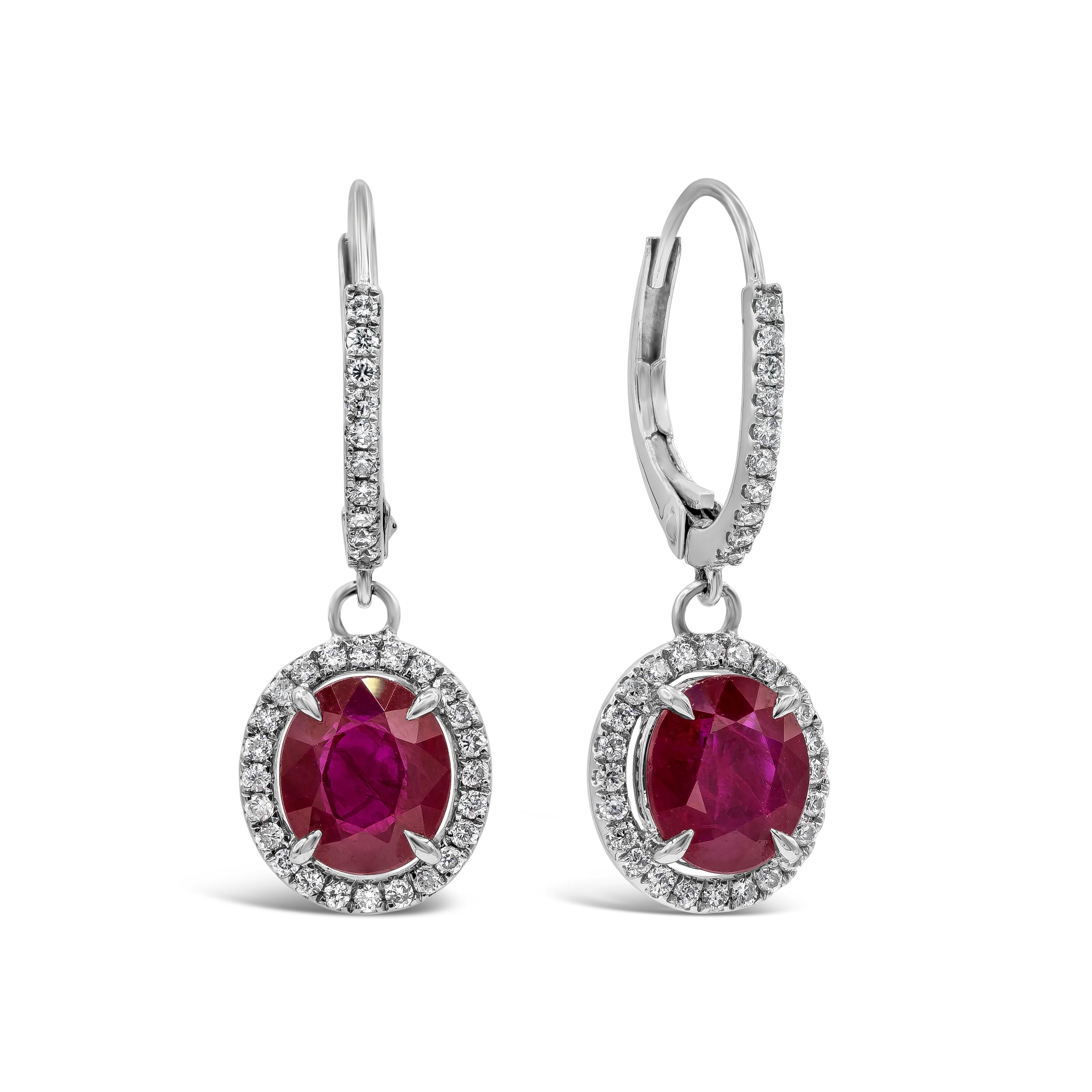 Contemporary Roman Malakov 2.83 Carats Total Oval Cut Ruby and Diamond Halo Dangle Earrings For Sale