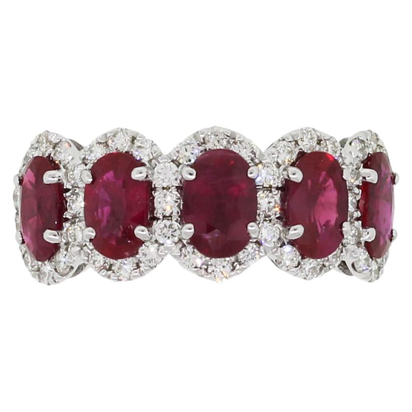 Oval Cut Ruby and Diamond Halo Ring
