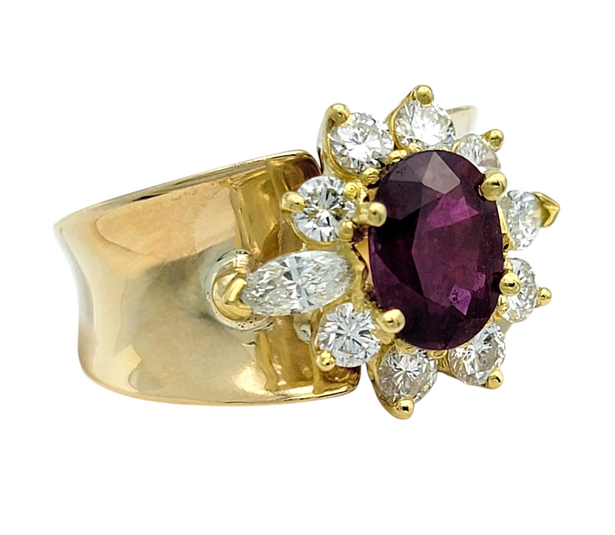 Ring Size: 7 

This exquisite ruby and diamond ring is a captivating blend of timeless elegance and striking design. At the heart of this masterpiece is a richly hued natural ruby, its deep red color radiating a fiery brilliance. The 1.47 carat
