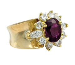 Oval Cut Ruby and Diamond Halo Wide Band Ring in Polished 14 Karat Yellow Gold