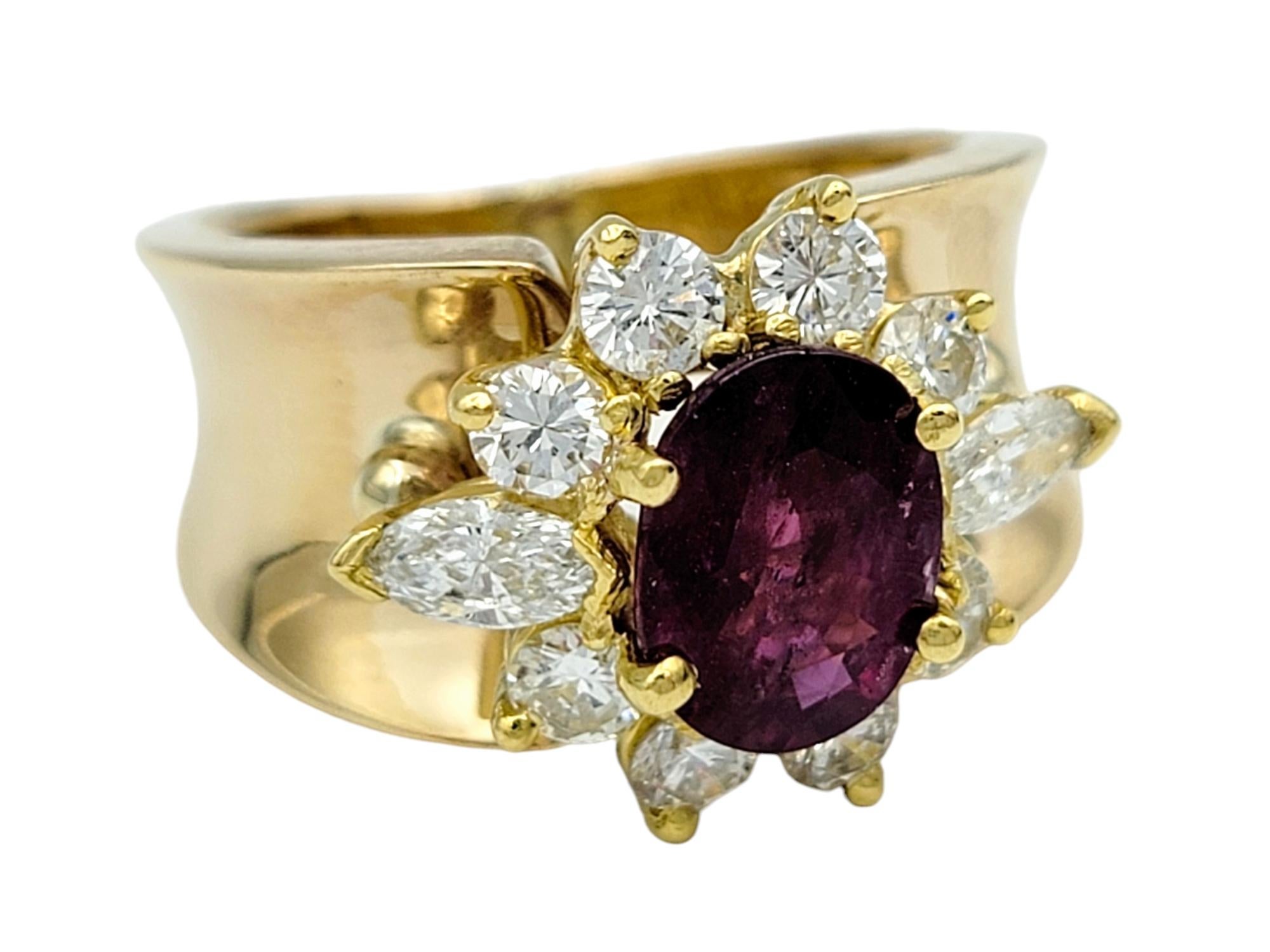 Contemporary Oval Cut Ruby and Diamond Halo Wide Band Ring in Polished 14 Karat Yellow Gold For Sale