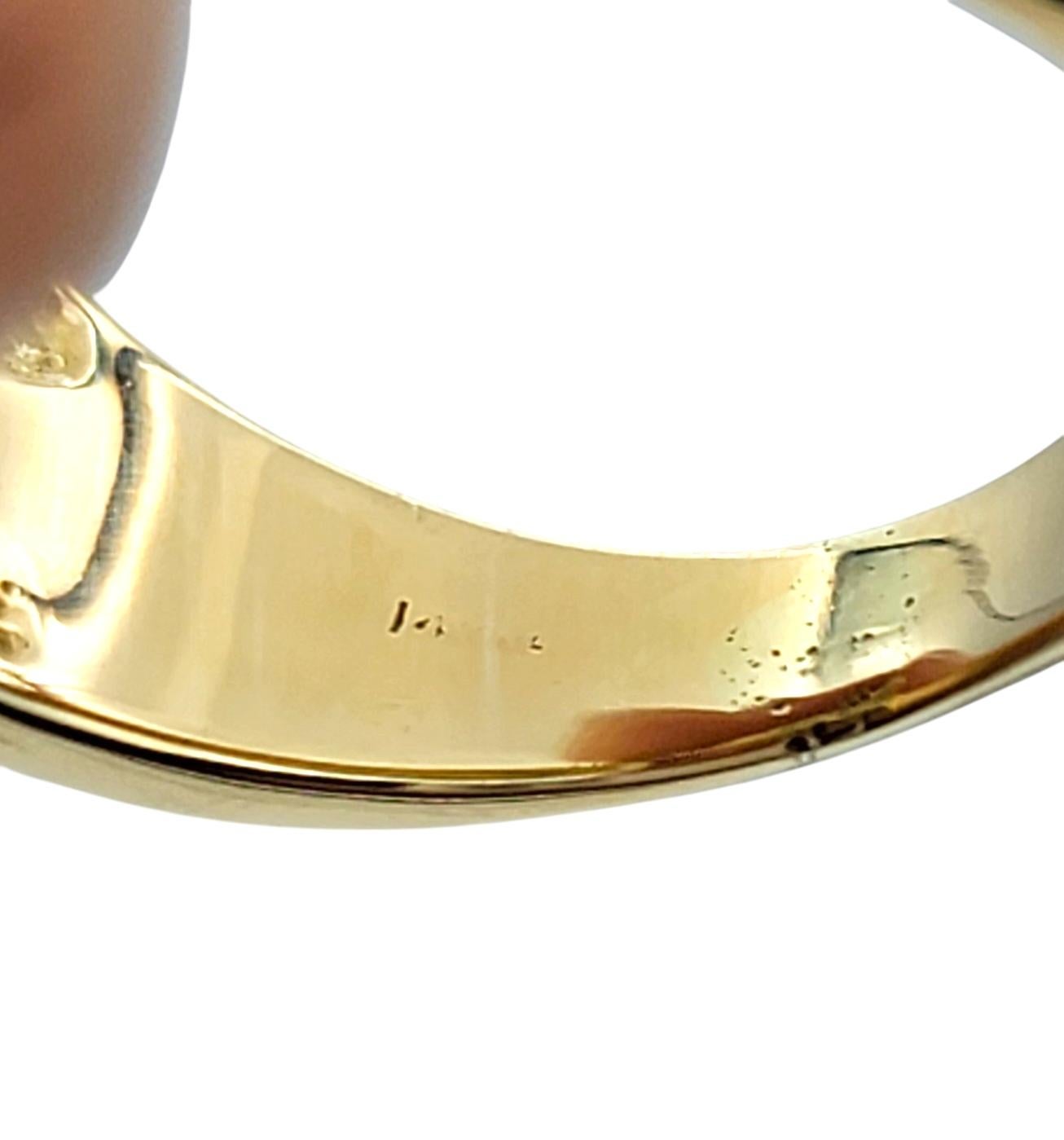 Oval Cut Ruby and Diamond Halo Wide Band Ring in Polished 14 Karat Yellow Gold For Sale 2