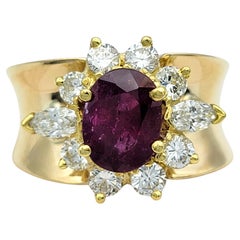 Oval Cut Ruby and Diamond Halo Wide Band Ring in Polished 14 Karat Yellow Gold