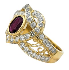 Oval Cut Ruby and Diamond Heart Motif Cocktail Ring in 18 Karat Yellow Gold