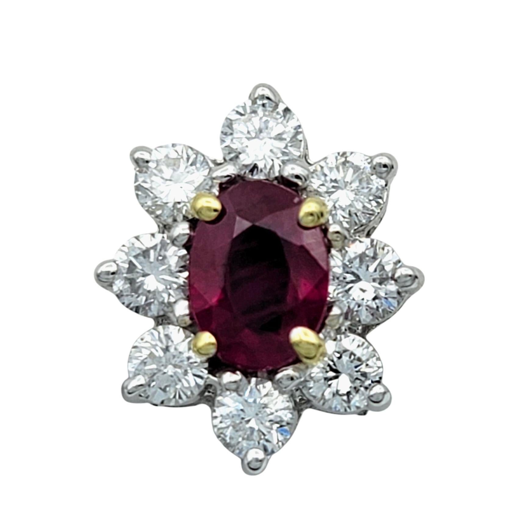 These breathtaking stud earrings feature vivid oval-cut rubies, their deep red hue exuding passion and sophistication. Each ruby is securely set in warm 18 karat yellow gold prongs, enhancing its rich color and regal presence. Surrounding the center