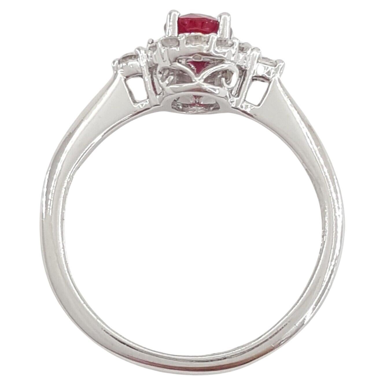 Modern Oval Cut Ruby Baguette & Round Brilliant Cut Diamond Halo Engagement Ring For Sale
