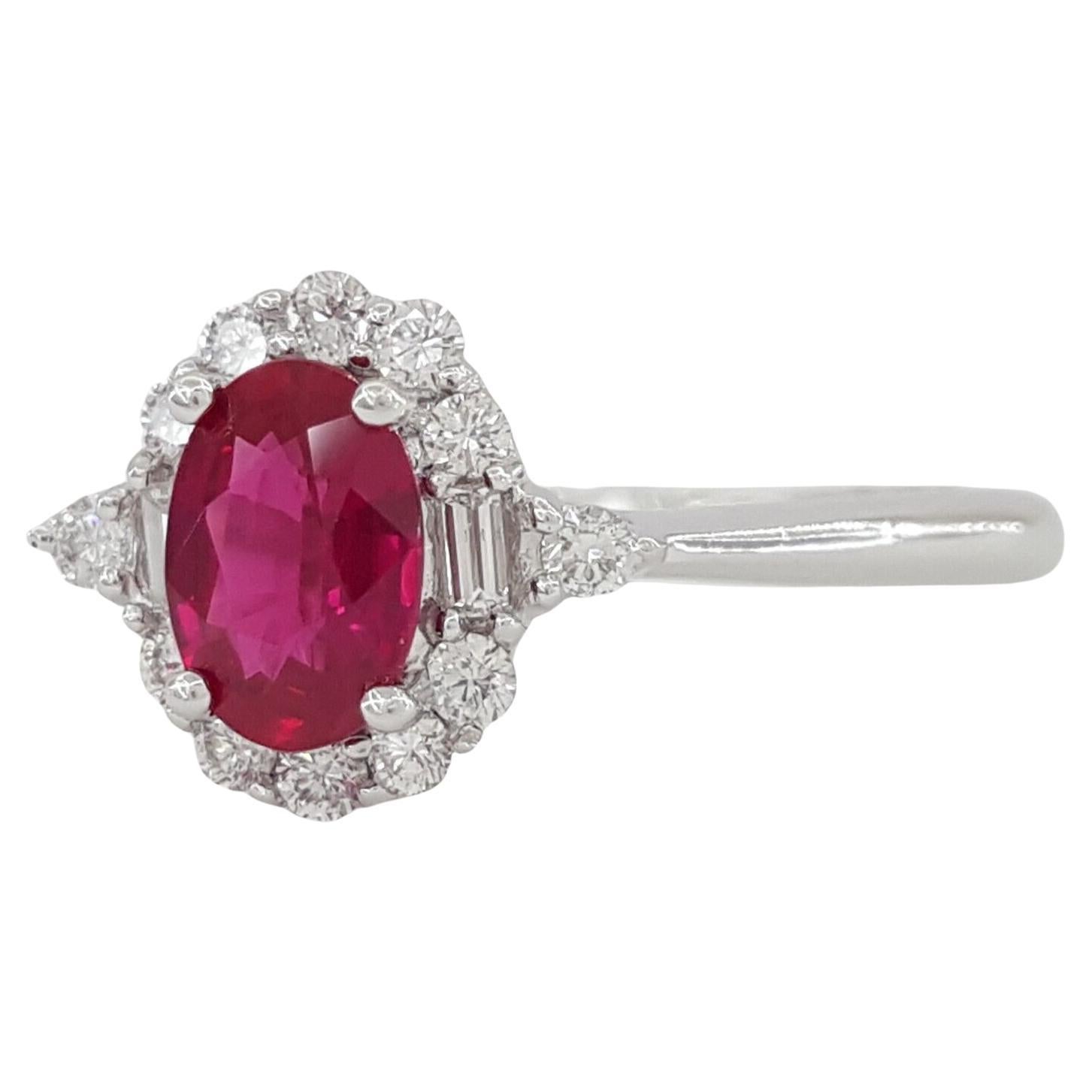 Oval Cut Ruby, Baguette & Round Brilliant Cut Diamond Halo Engagement Ring Set in 14k White Gold .



The ring weighs 2.1 grams, size 4.75, the center is a Natural Oval Brilliant Cut Natural Red Ruby weighing ~0.47 ct.



There are 2 Natural
