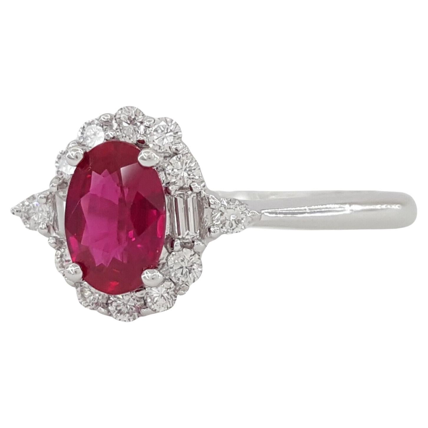 Oval Cut Ruby, Baguette & Round Brilliant Cut Diamond Halo Engagement Ring Set in 14k White Gold .



The ring weighs 2.1 grams, size 4.75, the center is a Natural Oval Brilliant Cut Natural Red Ruby weighing ~0.47 ct.



There are 2 Natural