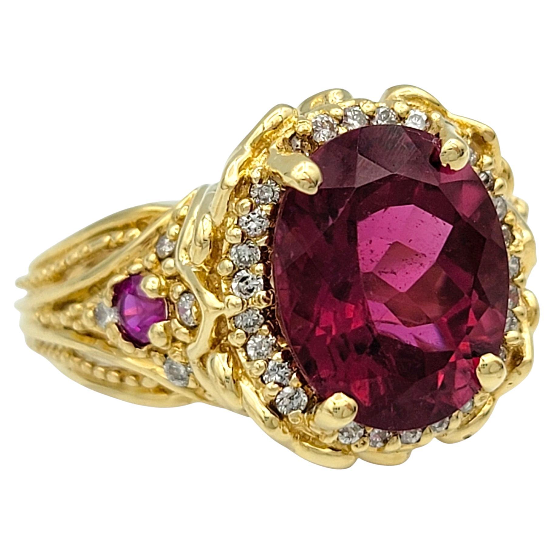 Ring Size: 6

Discover a masterpiece of elegance with this enchanting rubellite, ruby and diamond ring, a true celebration of timeless luxury. At the heart of this design lies a captivating oval-cut rubellite tourmaline, its intense pink red hue