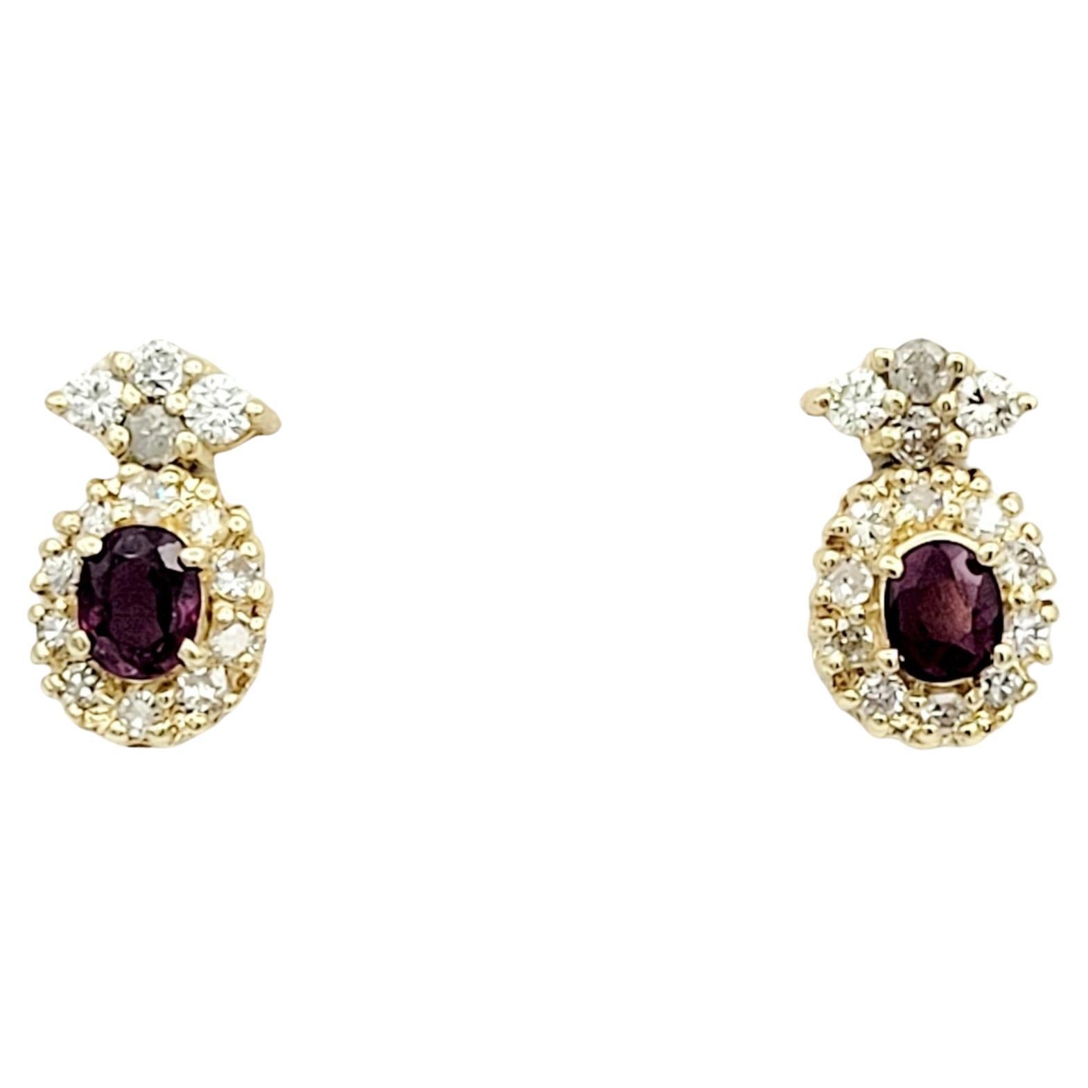 Oval Cut Ruby Earrings with Round Diamond Halos Set in 14 Karat Yellow Gold For Sale