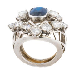 Oval Cut Sapphire and Diamond Dome Ring