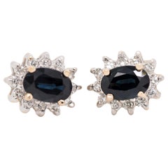 Oval Cut Sapphire and Diamond Halo Stud Earrings of 14 Karat Two-Tone Gold