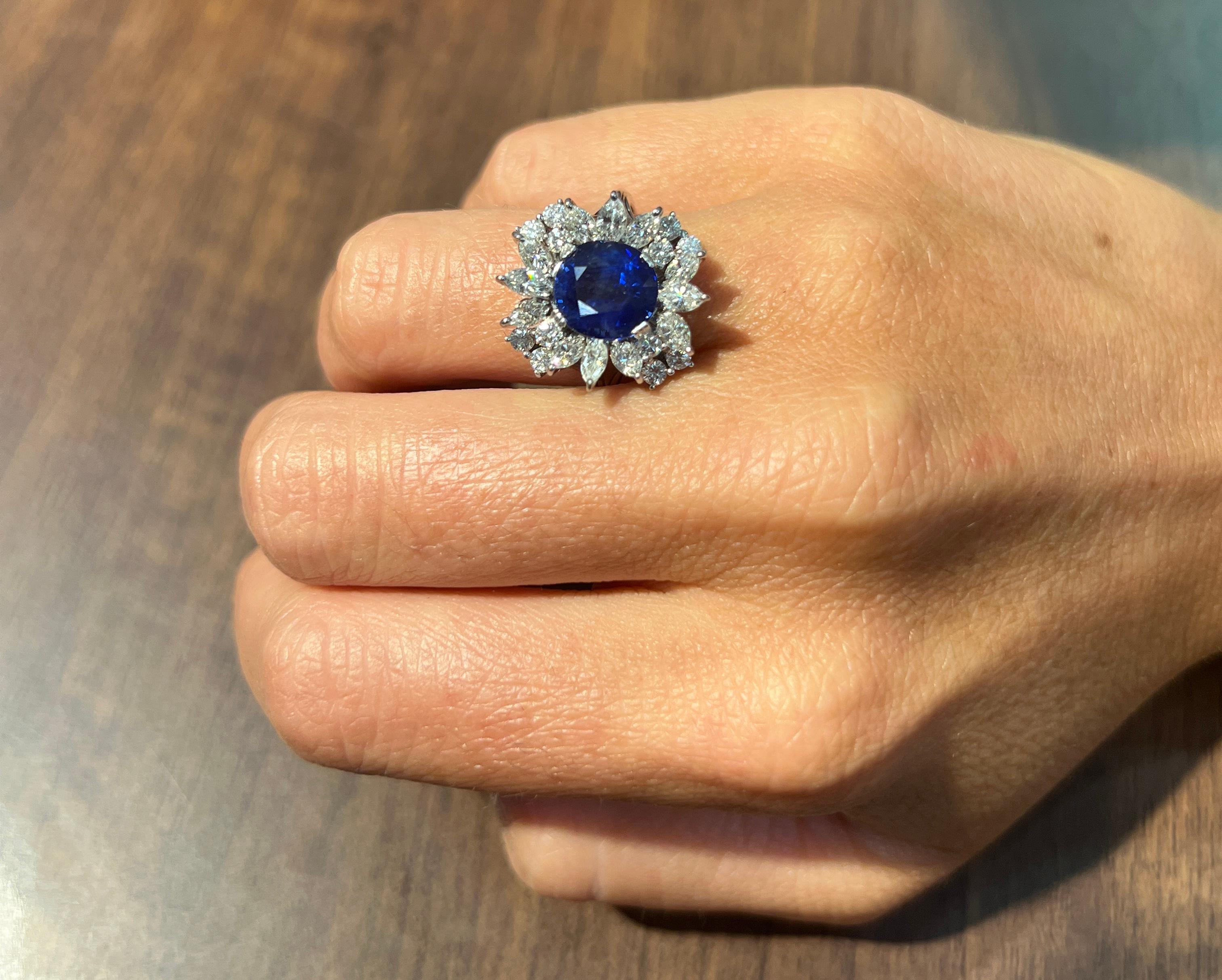 Oval Cut Sapphire & Diamond Cocktail Ring

A ring featuring a center oval cut sapphire surrounded by a cluster of marquise & round cut diamonds.

Sapphire Weight: approximately 4.40 carats 
Marquise Cut Diamond  Weight: approximately 1.18 carats