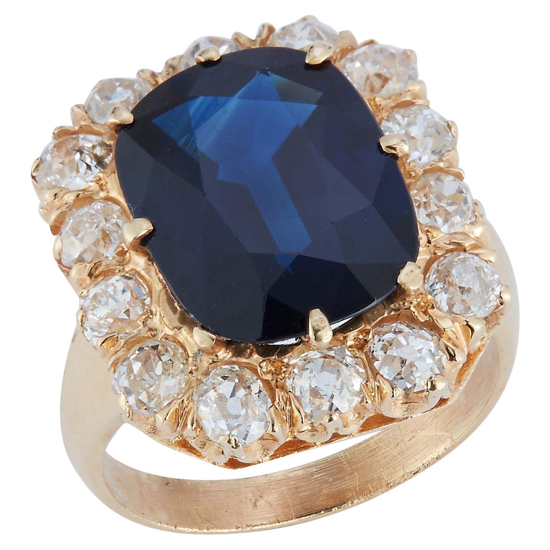 Oval Cut Sapphire & Diamond Halo Ring 