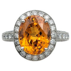 Oval Cut Spessartite Garnet and Diamond Halo Cocktail Ring in Platinum
