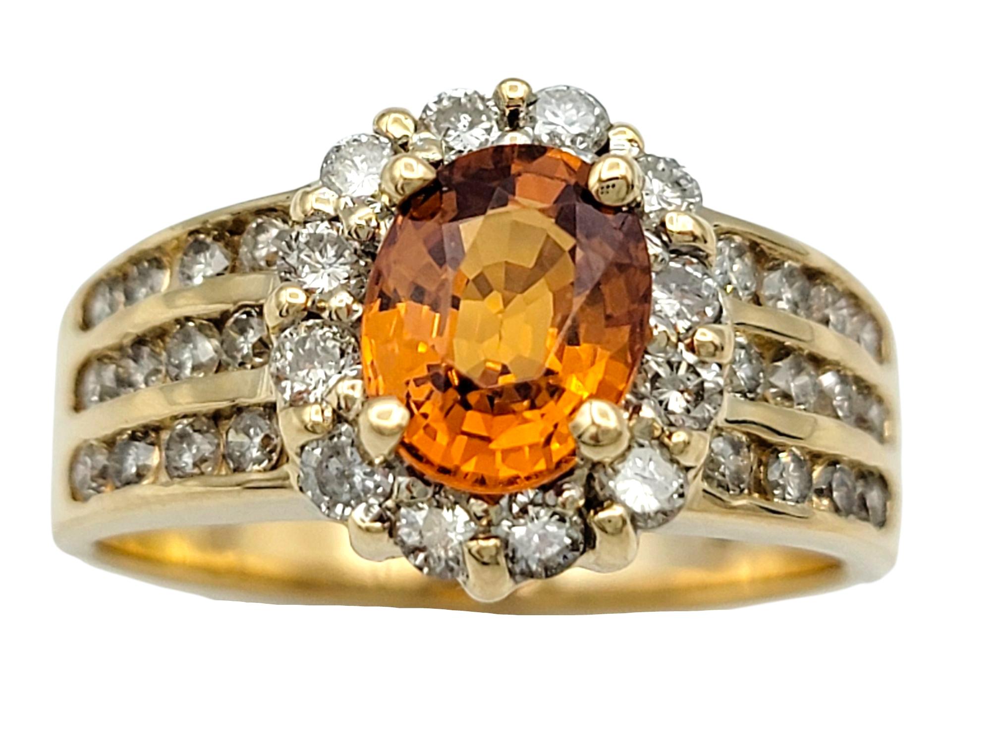 Ring Size: 8

This bold band ring centers on a vivid orange spessartite garnet in an elongated oval cut, displaying warm intensity and depth. The garnet is set in a raised bezel and framed by a seamless halo of round-cut diamonds.

Three rows of