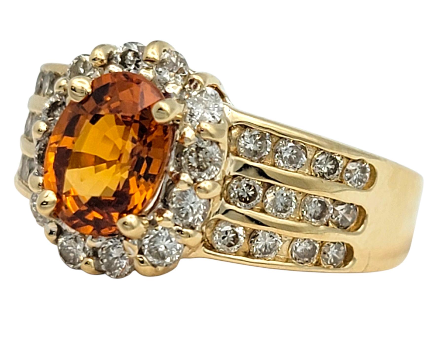 Contemporary Oval Cut Spessartite Garnet and Diamond Halo Wide Band Ring 14 Karat Yellow Gold For Sale